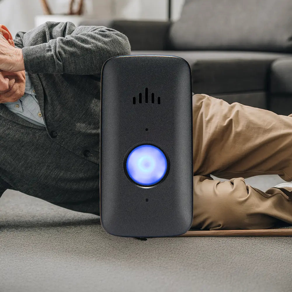 Person lying on the ground in the background with a Belle X device in focus.