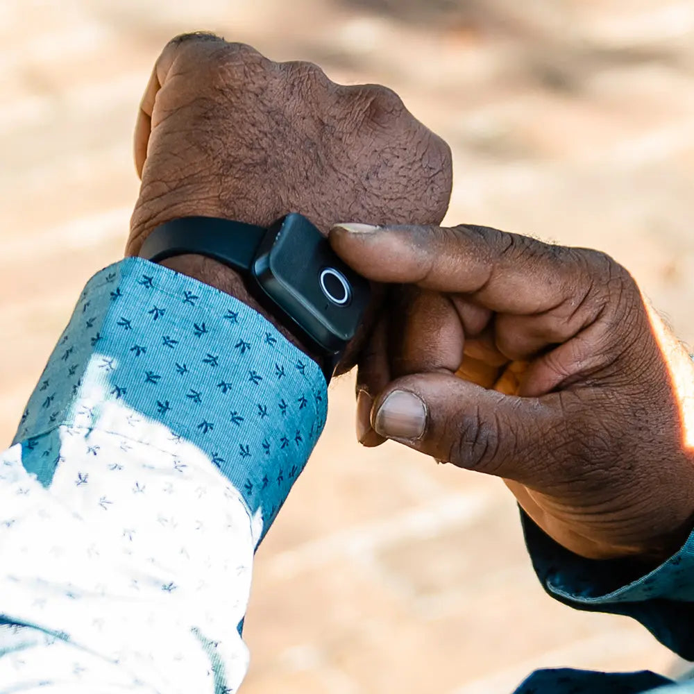 Close-up of a Belle W device on someone's wrist. 