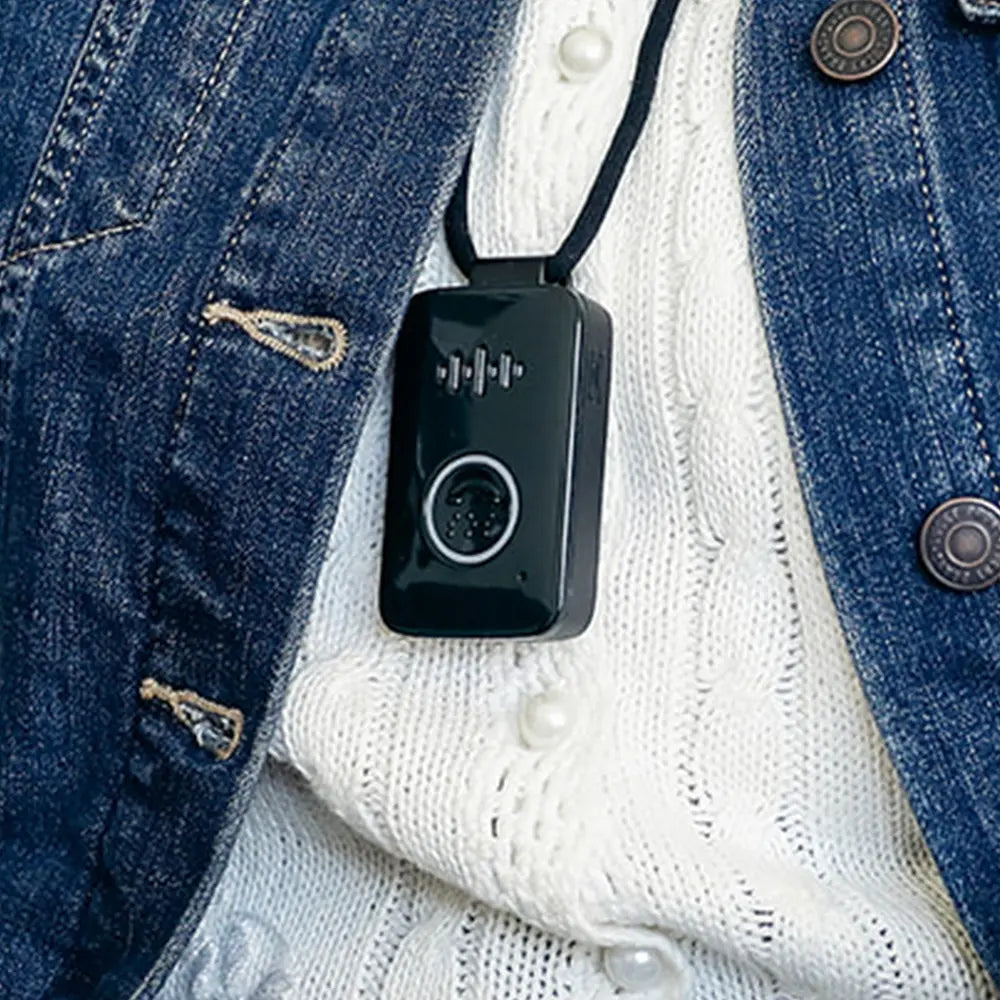 Belle S device on a blue denim jacket and white sweater.